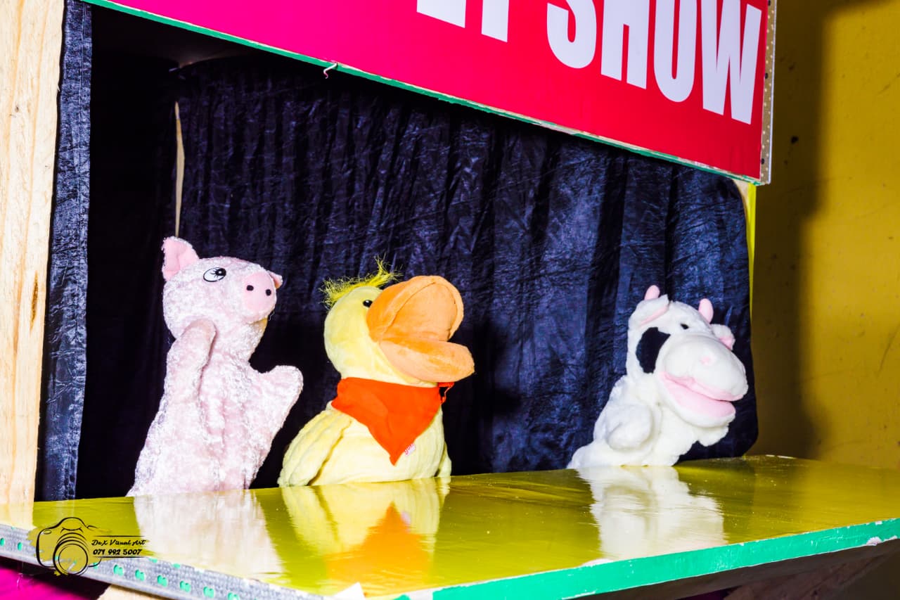 Pig, duck and cow hand puppets on the puppet show stage