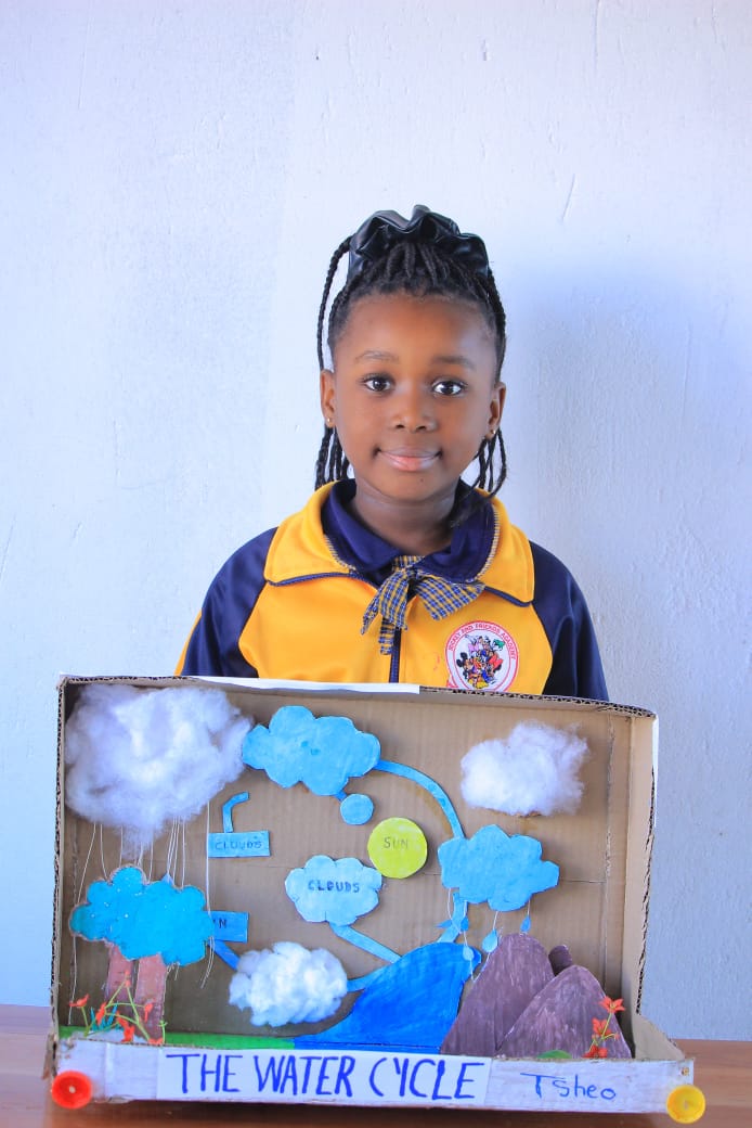Learner showing The Water Cycle cardboard model