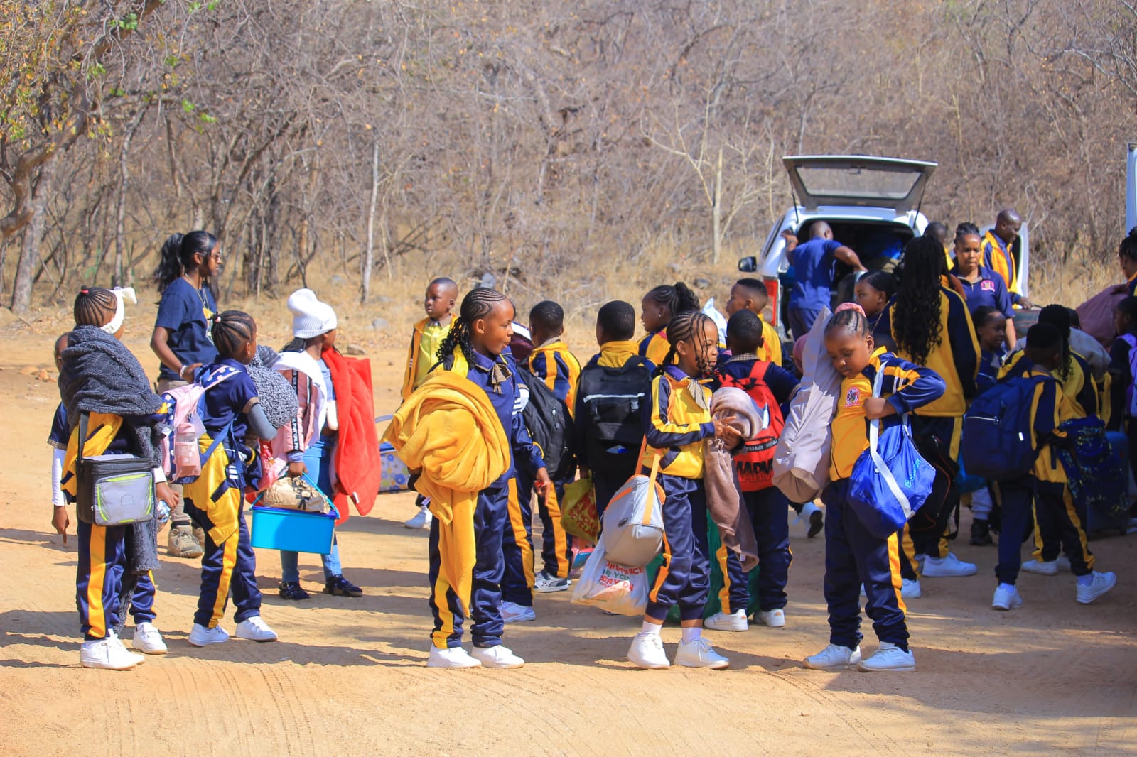 Learners arriving at the discipline camp with their bags