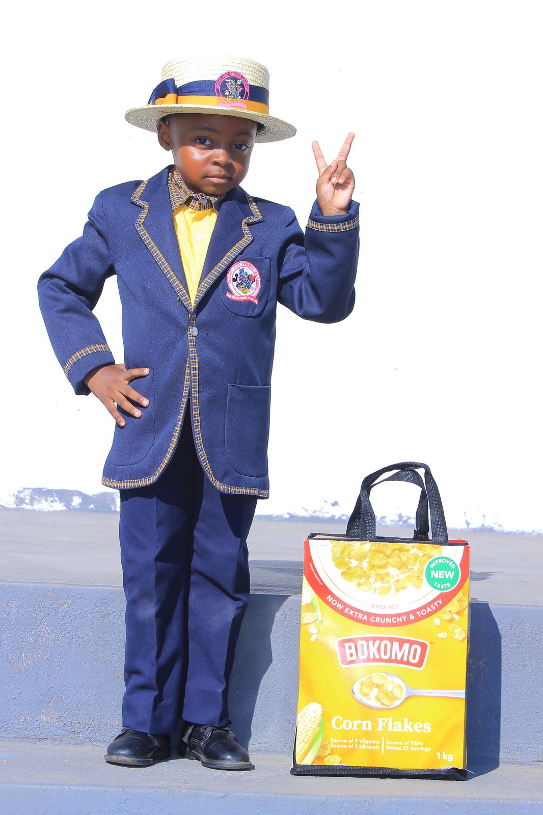 Pupil posing with a handmade Bokomo cereal box school bag